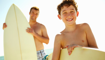 Photo: Father and Son with Surfboards