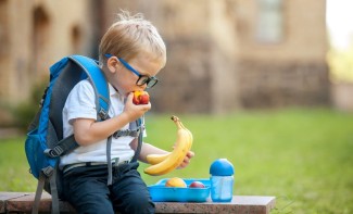 Photo: Boy eating a snack