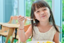 Photo: Girl eating lunch